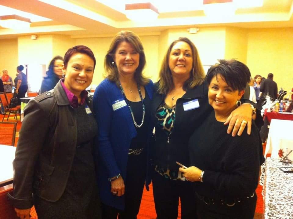 Margo with colleagues at a professional event